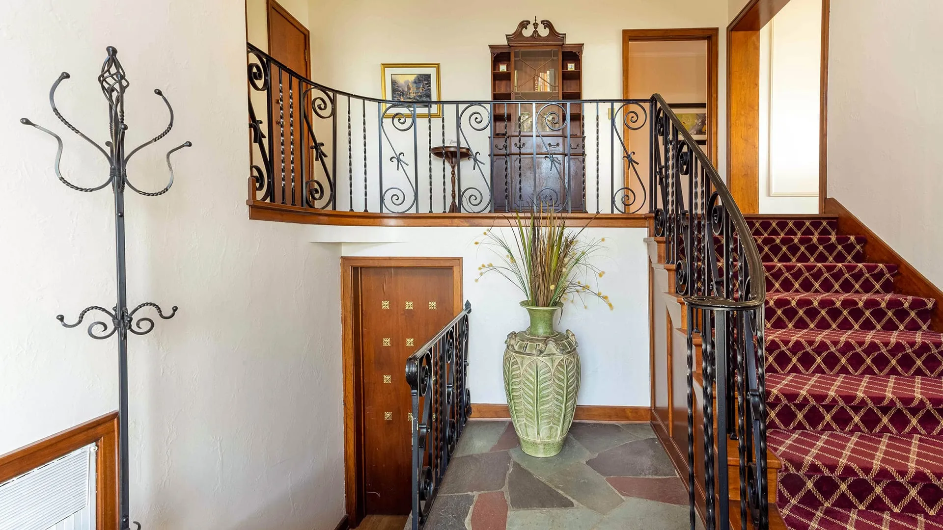 Red stairway with basement.