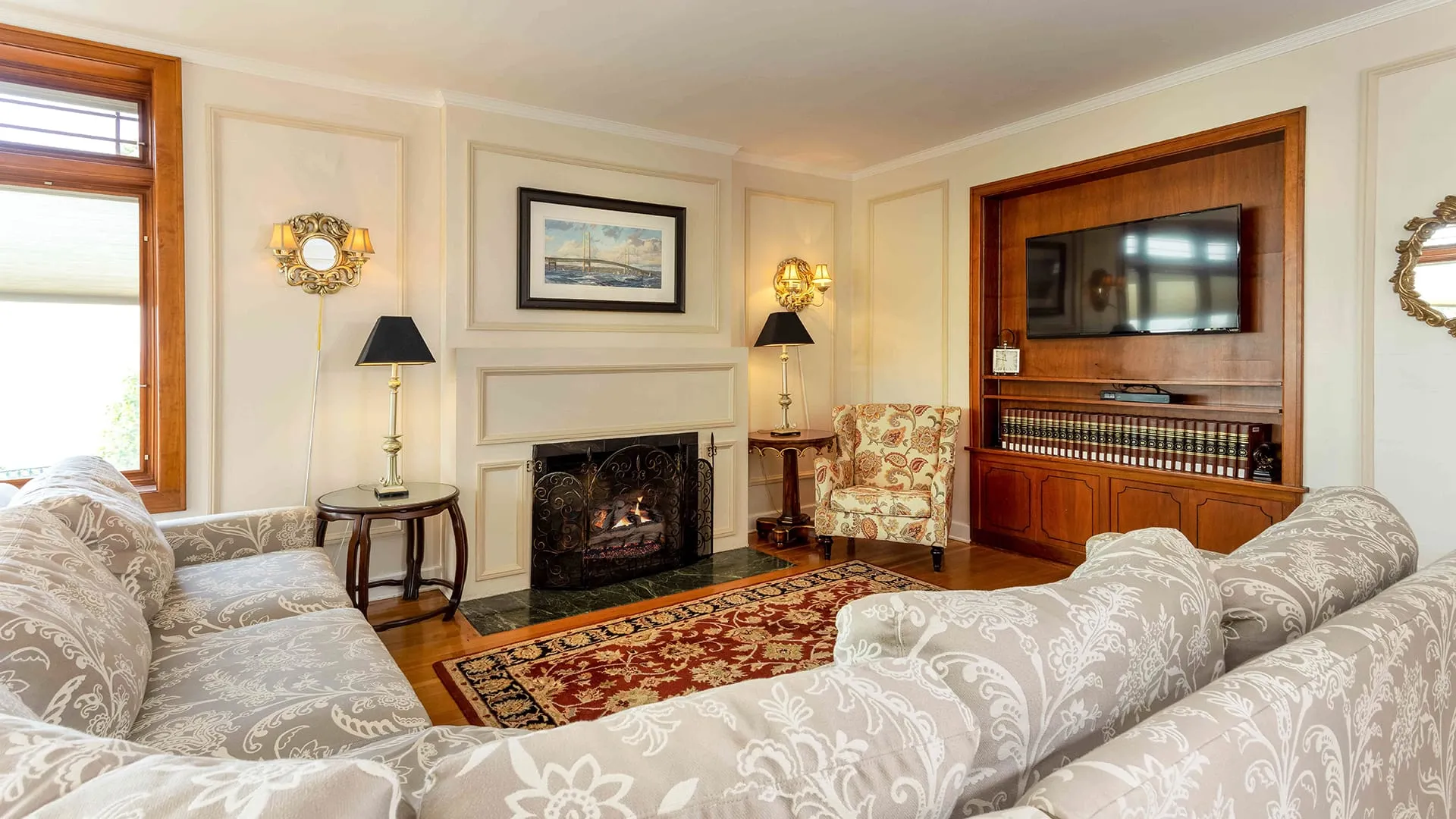 Hotel living room of couch and fireplace.